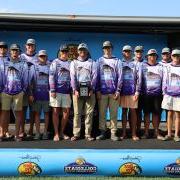 The University of Montevallo fishing team holds their School of the Year trophy.